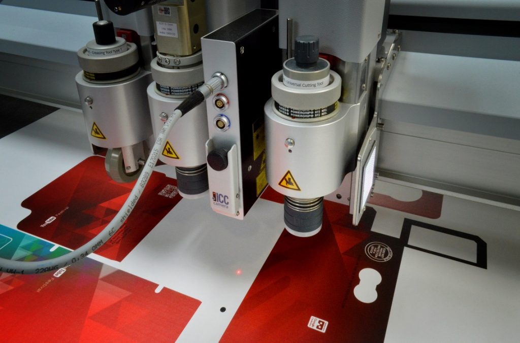 printer lasers printing red packaging
